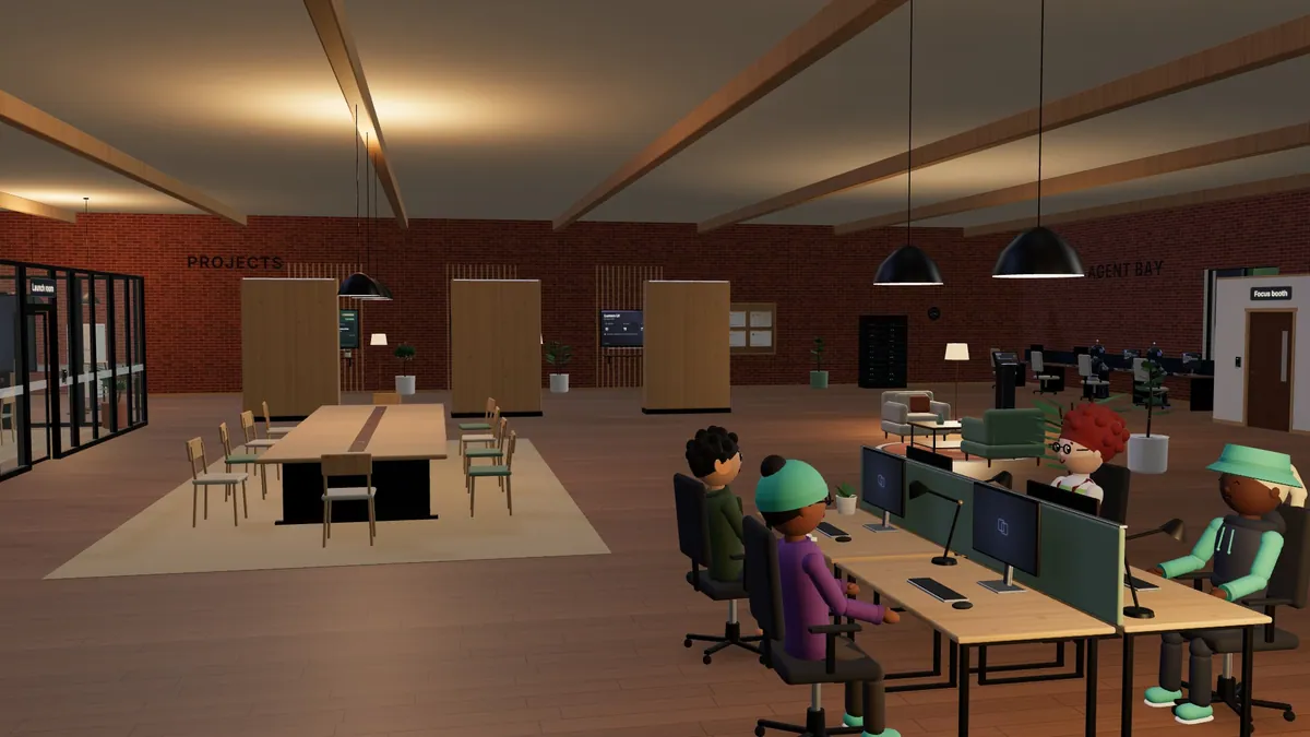 Evening in a DevSyncora studio: two people at their desks, the bookshelf and the arcade lit up behind them.